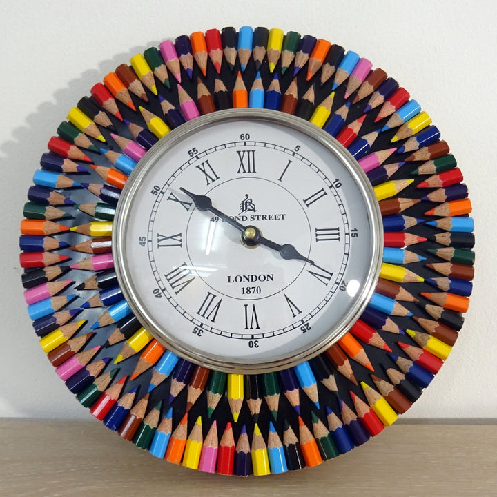 A hanging clock made from crayons