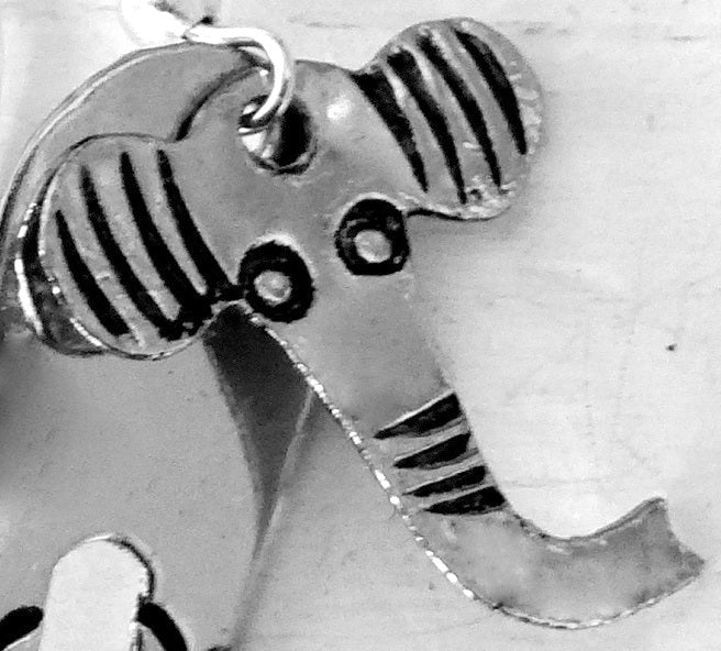 A close up of an elephant earrings